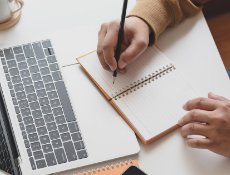 Writing on notebook